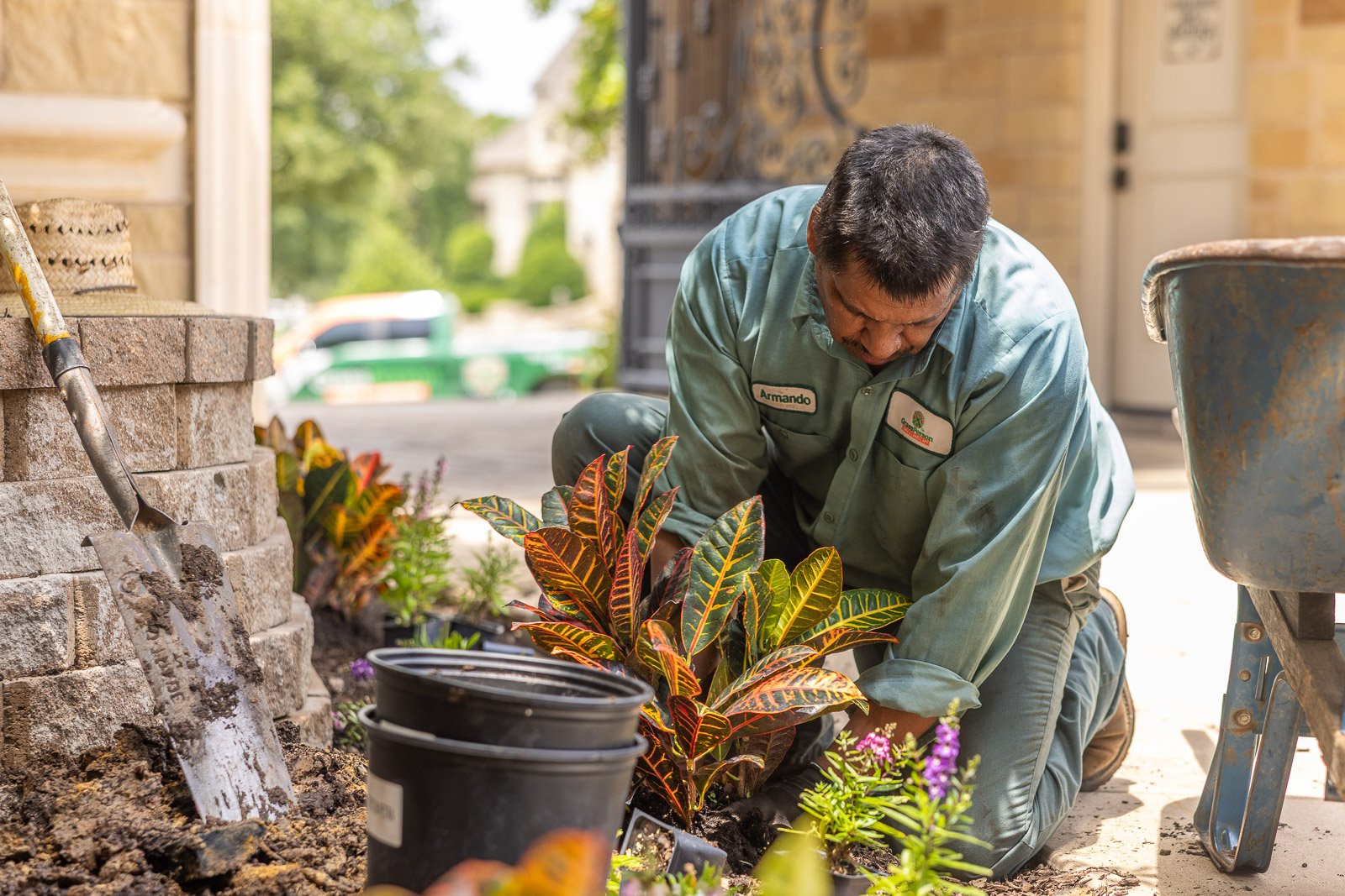 crew planting shrubs near retaining wall 2