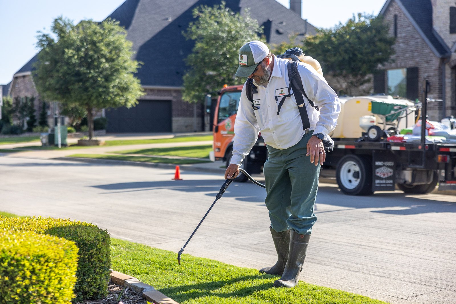 crew treating lawn for weeds