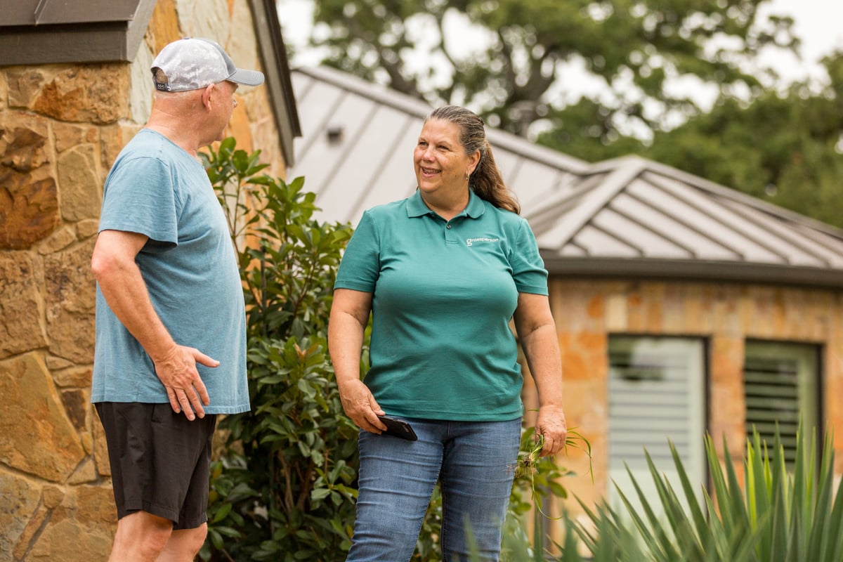 lawn care team account manager meets with homeowner