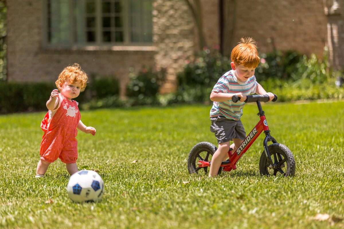 kids playing outside on lawn