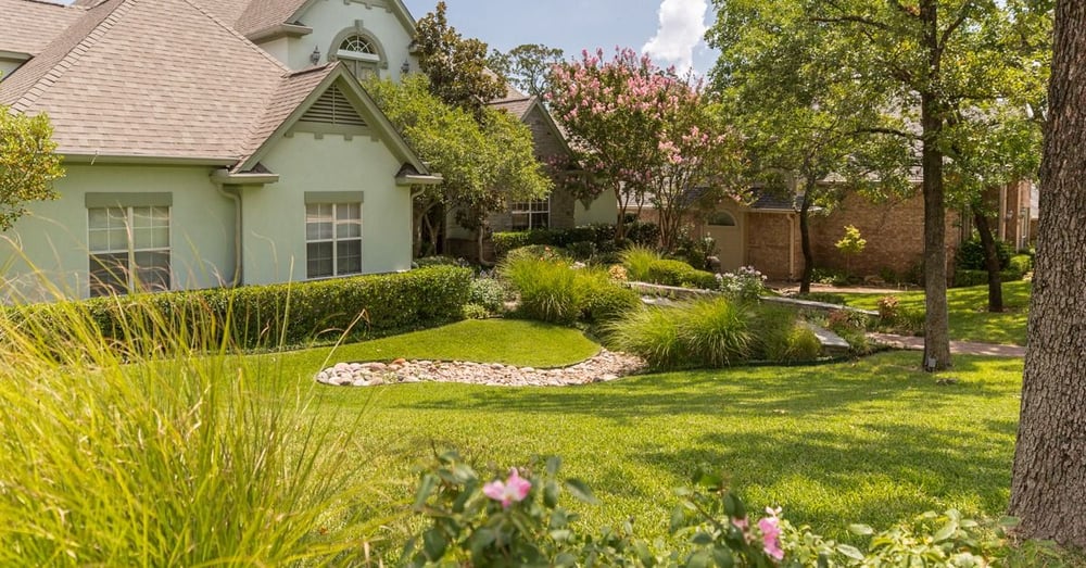 home with shade over grass