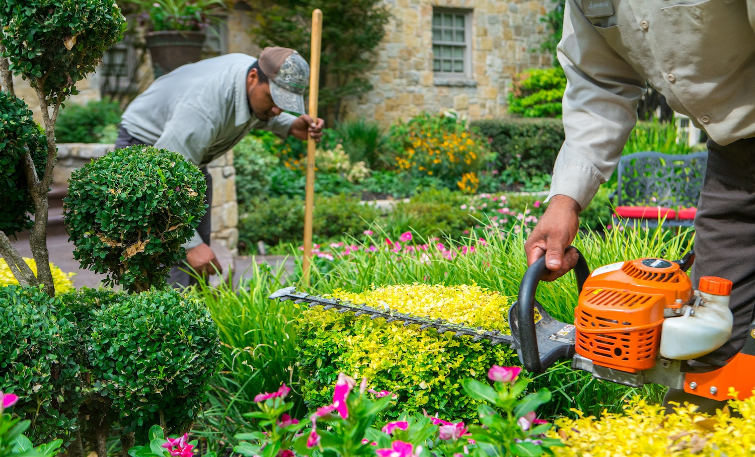 technicians performing landscaping job in Texas