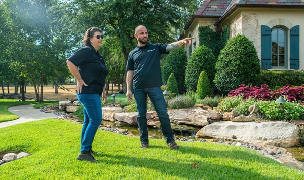 Two employees looking over a job