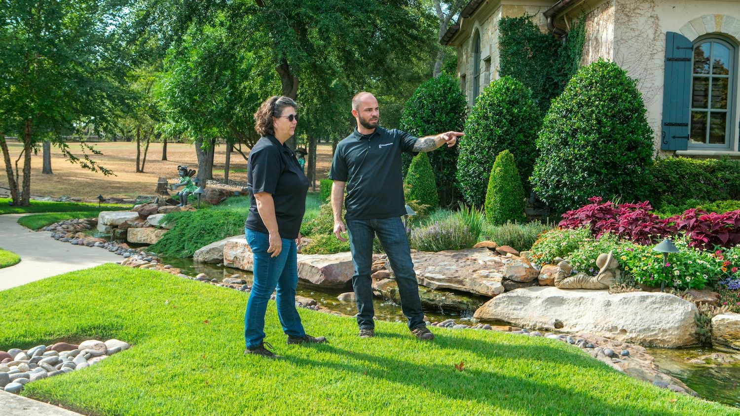 Lawn Care professionals assessing customer lawn