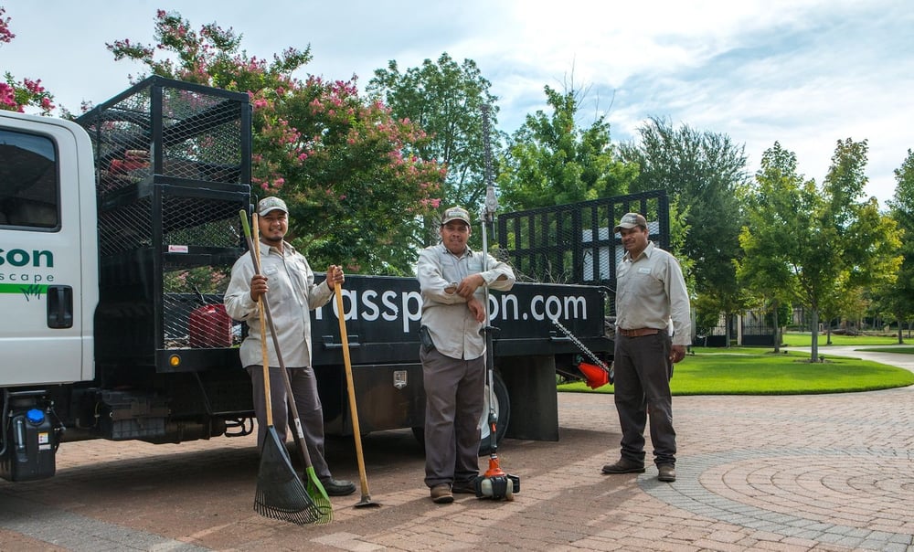grassperson-crew-truck-tools-driveway