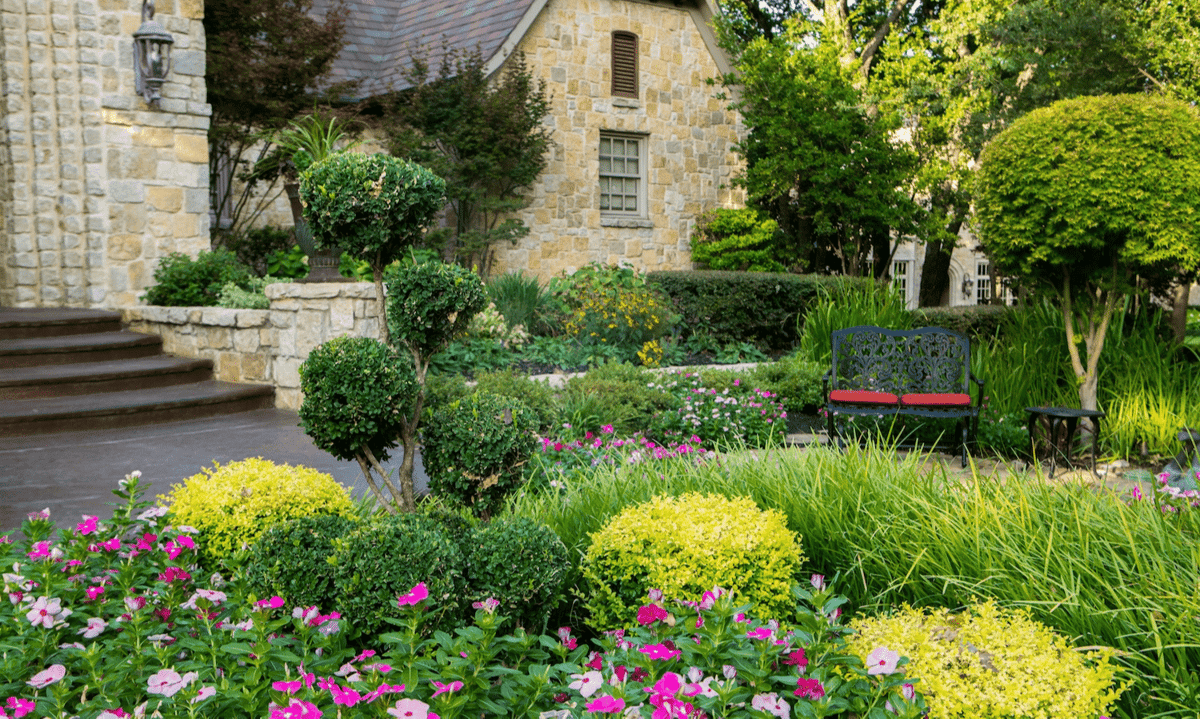 well maintained shrubs at entrance of home