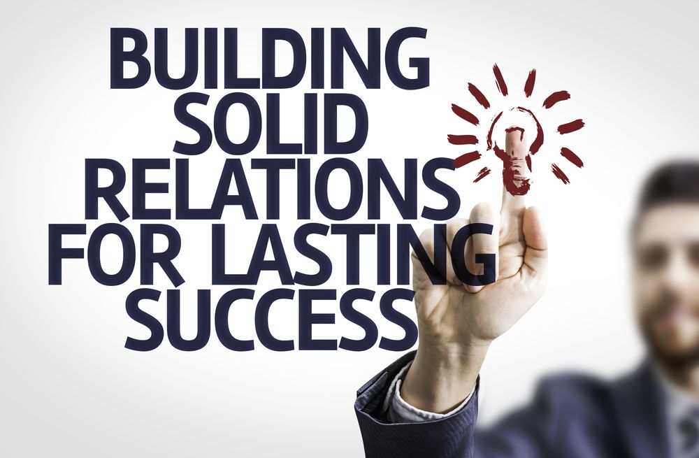 Customer service sign stating "building solid relations for lasting success"