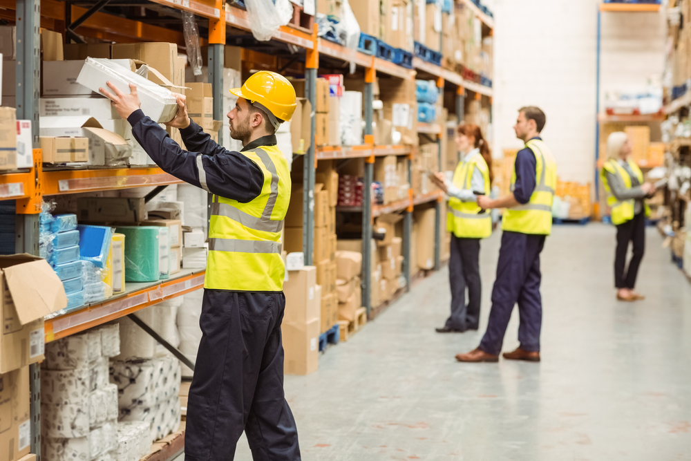 Warehouse workers sorting packages