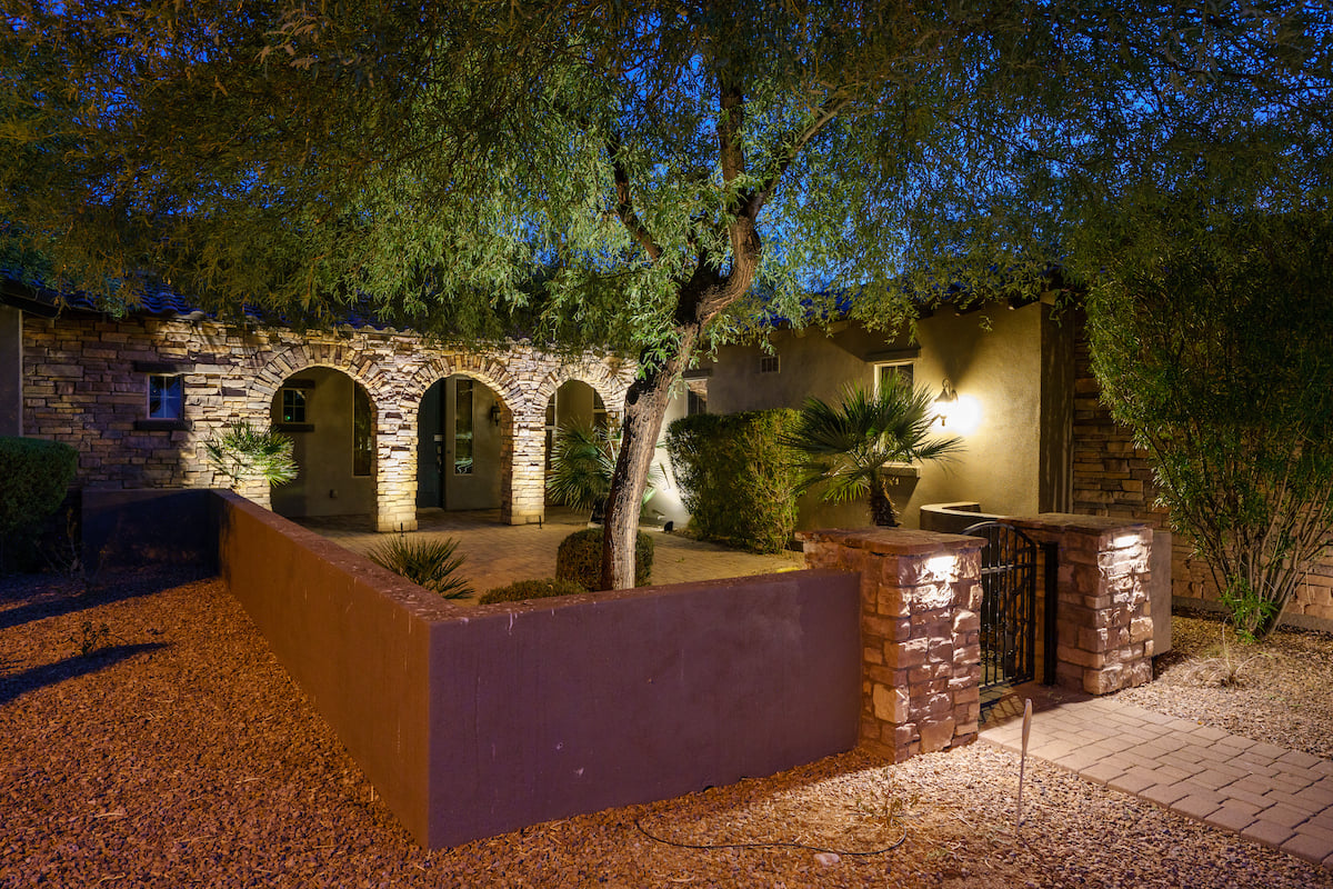 landscape lighting in courtyard with trees 