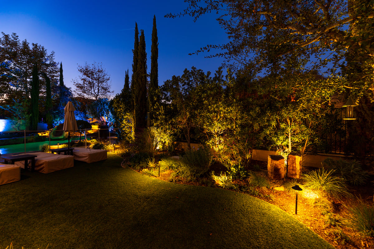 Landscape lighting near grass and pool
