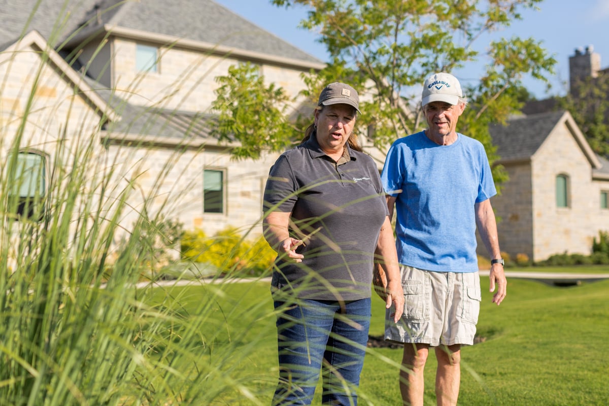 homeowner and customer inspecting property