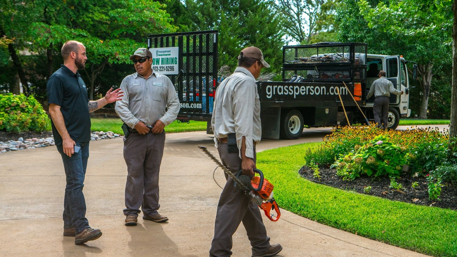 lawn care team in driveway