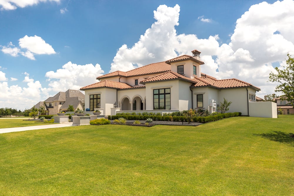 home with healthy lawn and landscape