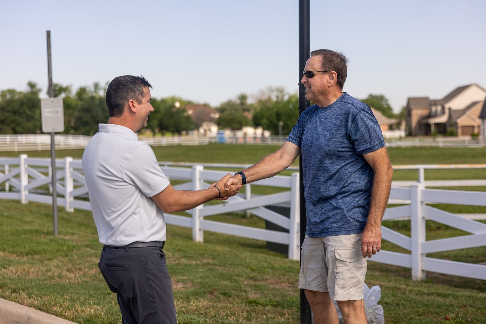 account manager and customer shaking hands