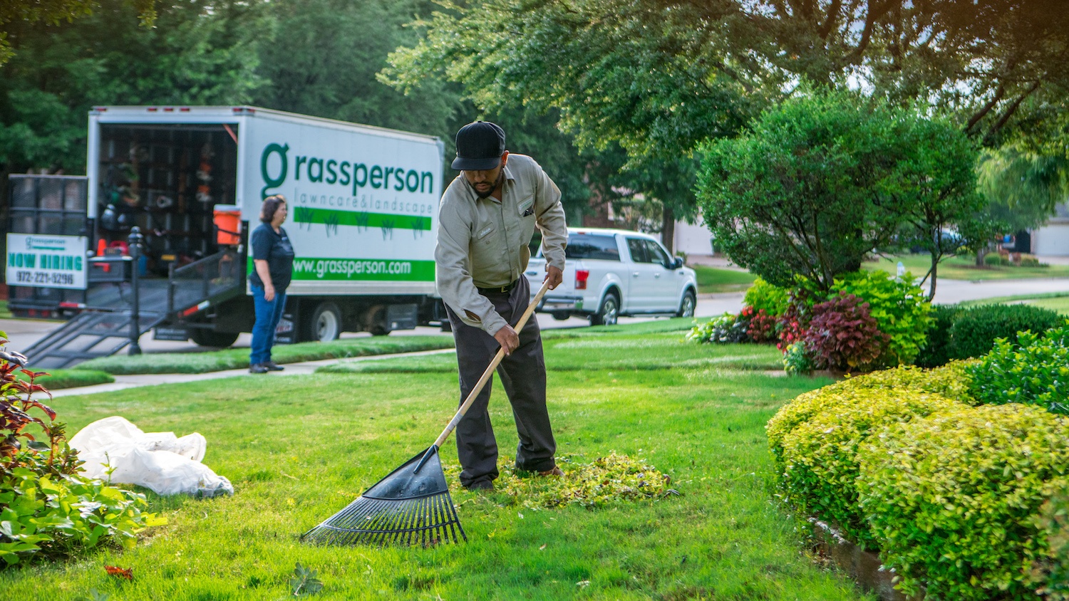 grassperson-crew-lawn-maintenance-leaf-raking-truck